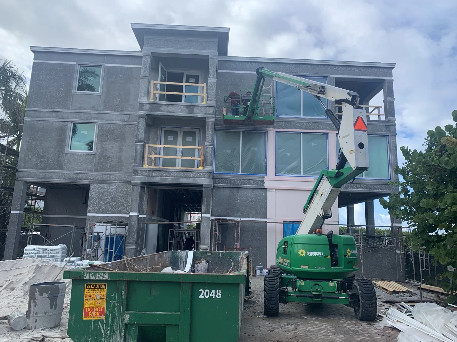 Stucco system installation underway on a large custom residence