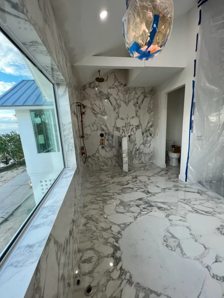 Luxury marble tile installation in a custom shower